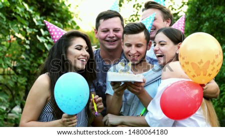 Similar – Man with piece of cake in a summer barbecue