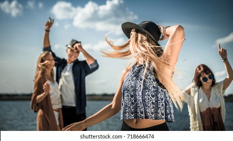 Group Of Friends Dancing And Celebrating On Beach, Boho Party Outdoor