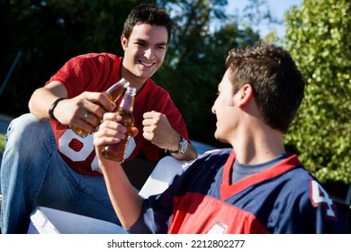 Group of friends doing football tailgating.  Cooking food, cheering, etc. - Shutterstock ID 2212802277