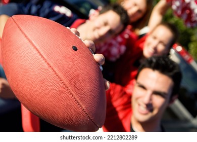 Group of friends doing football tailgating.  Cooking food, cheering, etc. - Shutterstock ID 2212802289