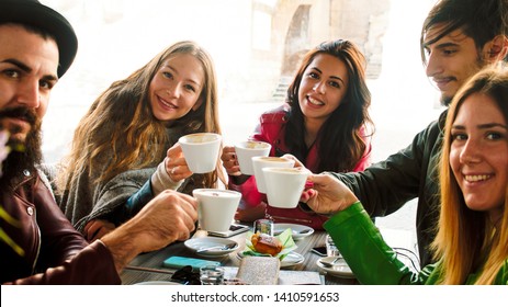 Group Of Friends Drinking Coffee Together Sitting At The Table. High Contrast Image