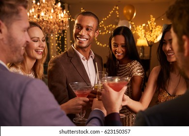 Group Of Friends With Drinks Enjoying Cocktail Party