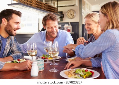 A Group Of Friends Eating At A Restaurant