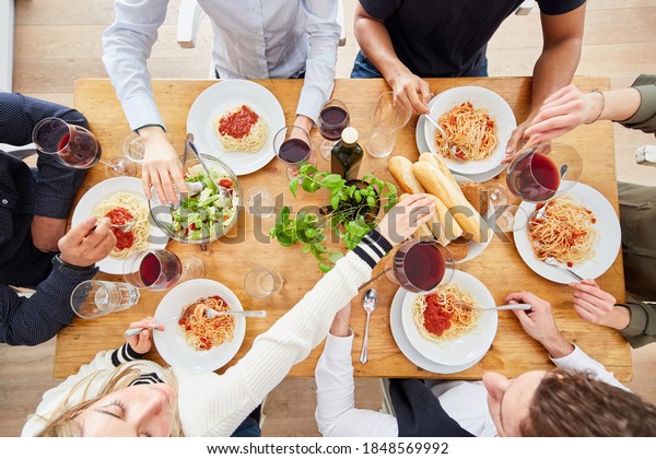 Group Friends Enjoy Pasta Meal Together Stock Photo (Edit Now) 1848569992