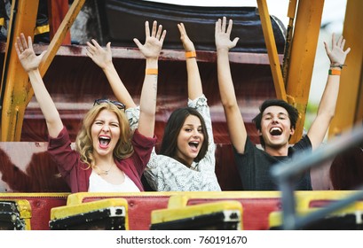 A Group Of Friends Is Enjoying The Amusement Park