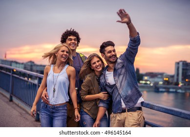 Group Of Friends Enjoying A City Tour Together.