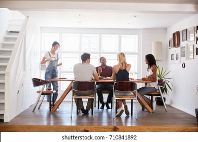 Group Of Friends Enjoying Dinner Party At Home Together