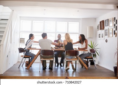 Group Of Friends Enjoying Dinner Party At Home Together