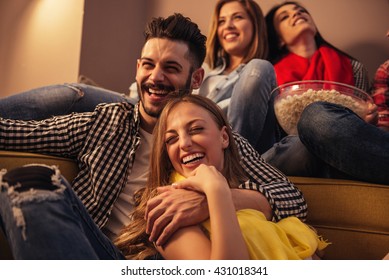 Group Of Friends Enjoying Movie Time At Home.