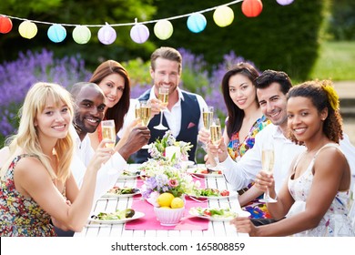 Group Of Friends Enjoying Outdoor Dinner Party