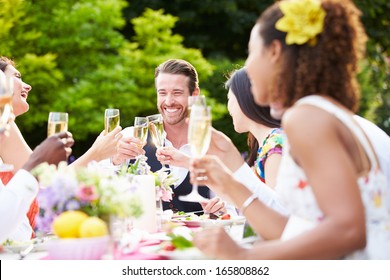 Group Of Friends Enjoying Outdoor Dinner Party
