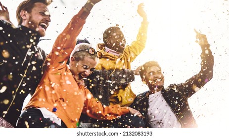 Group Of Friends Enjoying Party Throwing Confetti In The Air - Multicultural Young Students Having Fun Celebrating And Laughing Out Loud Outdoor - Youth, Friendship And Summertime Concept