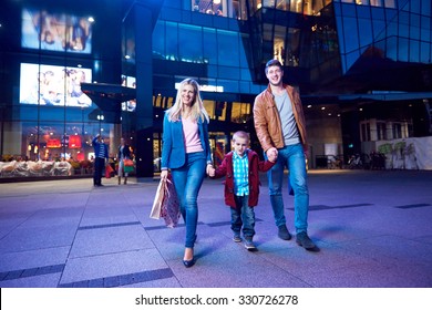 Group Of Friends Enjoying Shopping Trip Together
Group Of Happy Young Frineds Enjoying Shopping Night And Walking On Steet On Night In With Mall In Background