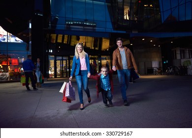 Group Of Friends Enjoying Shopping Trip Together
Group Of Happy Young Frineds Enjoying Shopping Night And Walking On Steet On Night In With Mall In Background