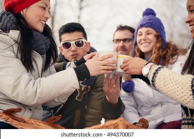 Group of friends enjoying in the snow in winter - Powered by Shutterstock