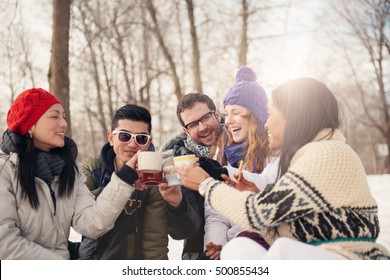 Group of friends enjoying in the snow in winter - Powered by Shutterstock