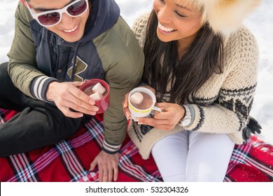 Group of friends enjoying in the snow in winter - Powered by Shutterstock