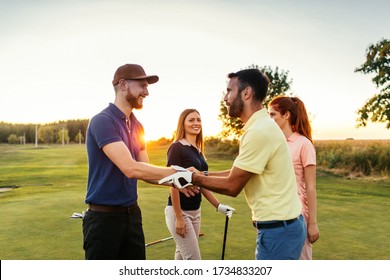 Group of friends enjoying sunny day on the golf course - Powered by Shutterstock