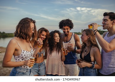 Group of friends enjoying a sunny day at the lake - Shutterstock ID 1743490967