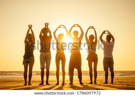 group of friends enjoying sunset in Goa India