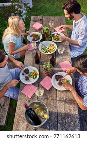 Group Of Friends Enjoying Their Outdoor Dinner Party