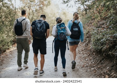 A group of friends explores a scenic mountain landscape, hiking and having fun conversations. They enjoy the fresh air and green environment while engaging in physical activity. - Powered by Shutterstock