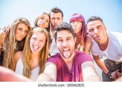 Group Of Friends Grimacing In Front Of The Camera - Young Happy People Having Fun At Party And Making Funny Faces While Photographing Themselves