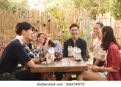 Group Of Friends Hang Out In Cafe