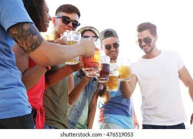 Group of friends hanging out together outdoors - Powered by Shutterstock