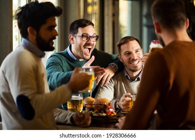 Group of friends have fun in beer pub