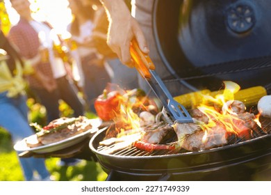 Group of friends having barbecue party outdoors, closeup - Powered by Shutterstock