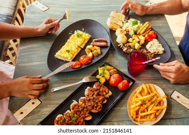 Group of friends having breakfast in the restaurant - Powered by Shutterstock