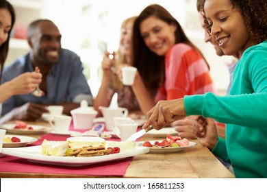 Group Of Friends Having Cheese And Coffee Dinner Party