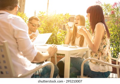 group of friends having a coffee outdoor and having fun. concept about friendship and people - Powered by Shutterstock