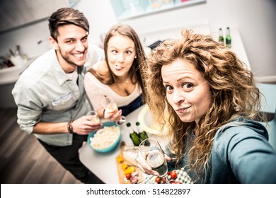 Group of friends having dinner home - Powered by Shutterstock