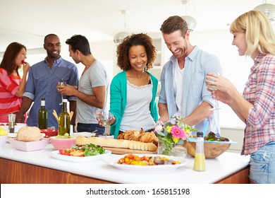 Group Of Friends Having Dinner Party At Home