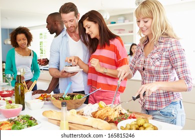 Group Of Friends Having Dinner Party At Home