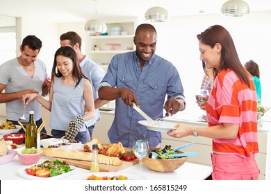 Group Of Friends Having Dinner Party At Home