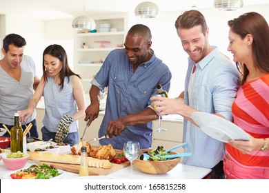 Group Of Friends Having Dinner Party At Home