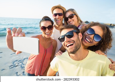 group of friends having fun at the beach - Powered by Shutterstock