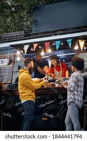 Group Of Friends Having Fun At Fast Food Mobile Service