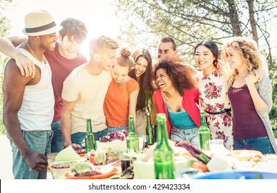 Group of friends having fun at the house barbecue. Eating and sharing good moods - Powered by Shutterstock