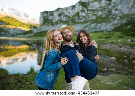 Group of friends having fun in a lake