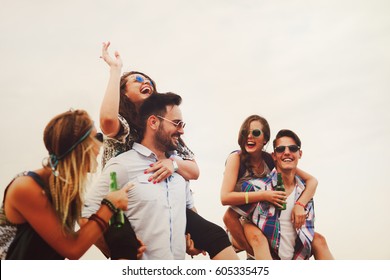 Group Of Friends Having Fun Outdoors And Are Happy