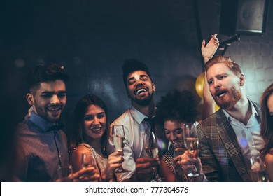 Group of friends having fun at a party - Shutterstock ID 777304576