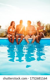 Group Of Friends Having Fun At The Poolside