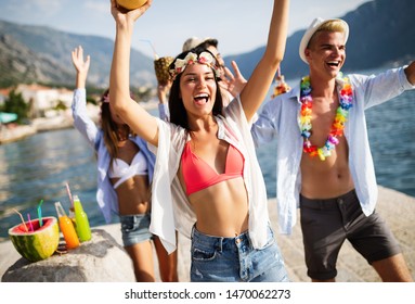 Group of friends having fun at summer party and drinking cocktail - Shutterstock ID 1470062273
