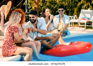 Group Of Friends Having Fun At Summer Vacation Enjoying At Poolside Party.