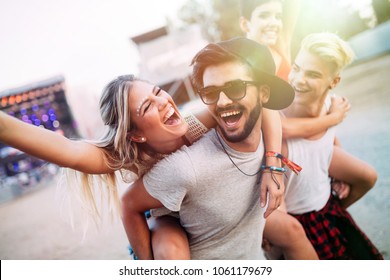 Group of friends having fun time at music festival