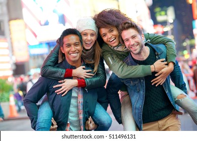 Group of friends having fun at Times Square, NYC                               